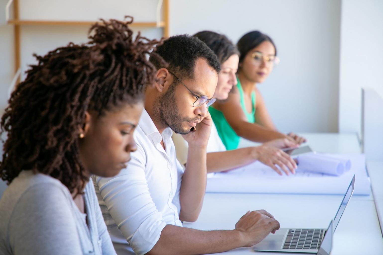 Professional development resources including notebooks, digital devices, and creative materials organized for skill building